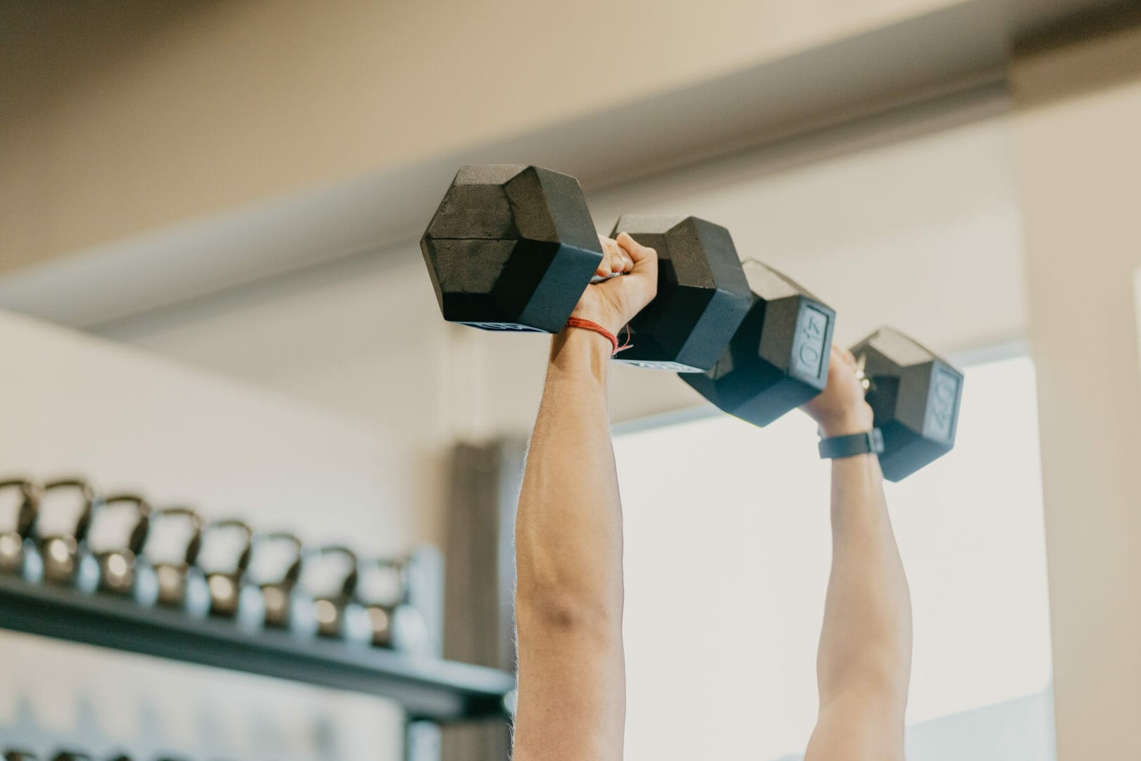 Closeup hands holding dumbbells at CrossFit Giddings